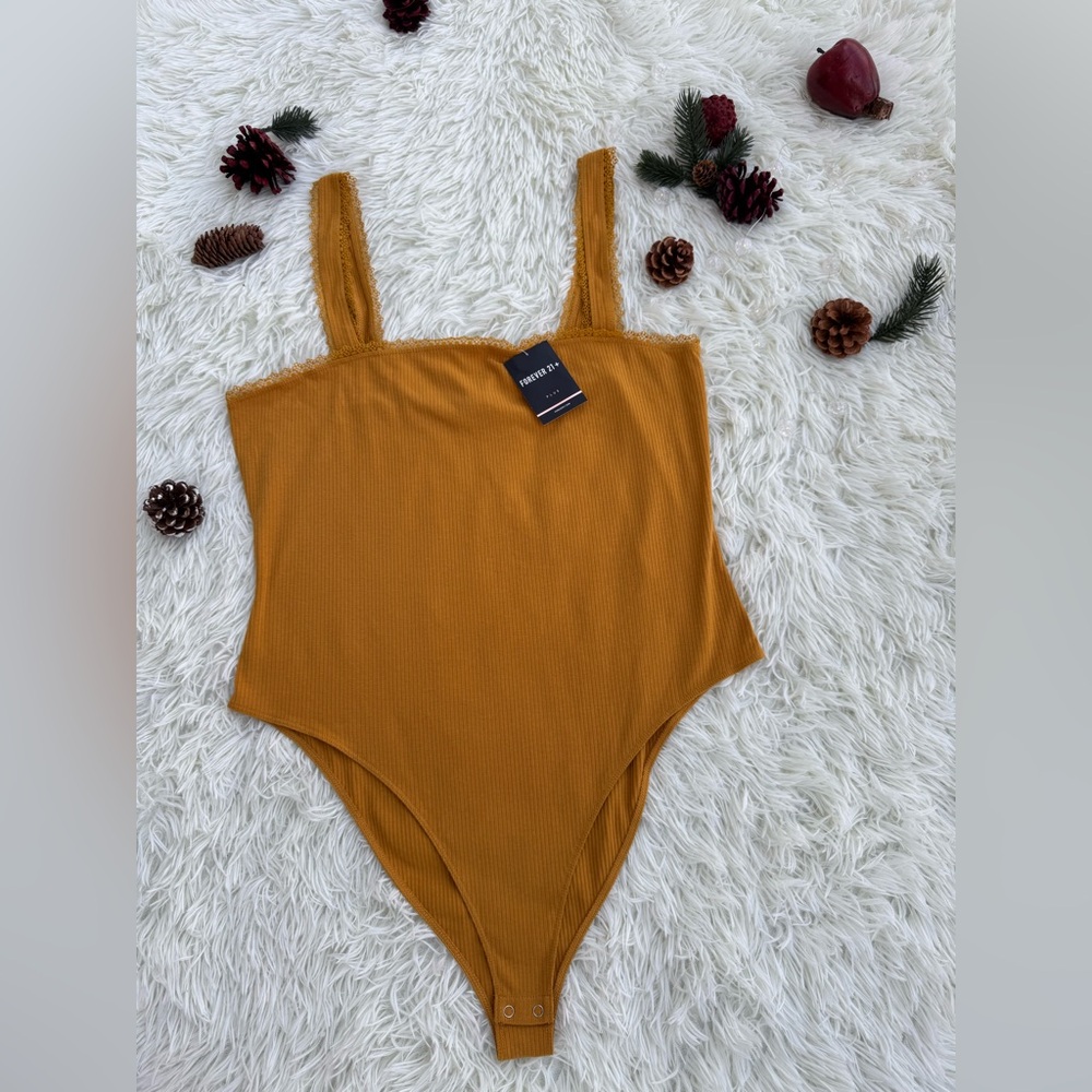 Forever 21 mustard-colored bodysuit with lace details. Size 2X